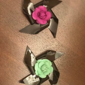 2 patent leather Chanel brooches